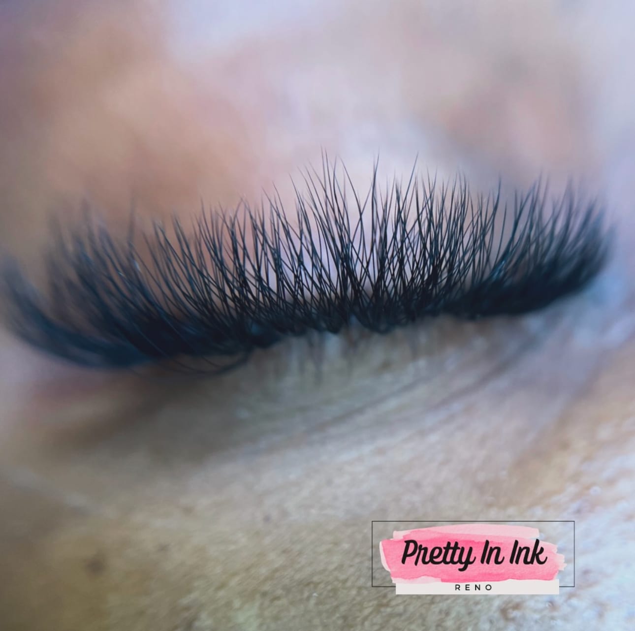Hybrid lash extensions being isolated and applied